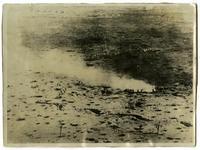 Men leaving smoke coming from trench