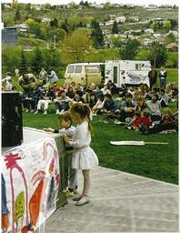 Children by the stage at Riverside Park