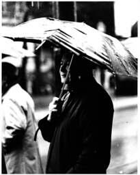 Person standing in the rain