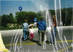 Peace walk participants crossing the street