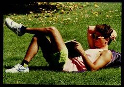 Student reading on campus