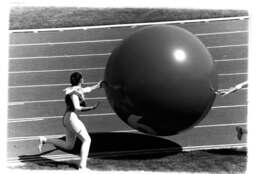 Woman and giant ball