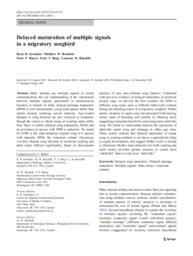 Delayed maturation of multiple signals in a migratory songbird
